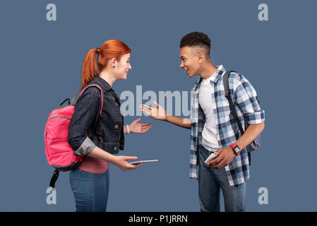 Joyful positive people looking at each other Stock Photo
