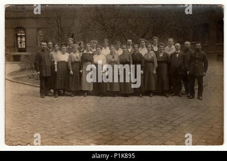 GERMANY - CIRCA 1920s: Vintage photo shows a big group of people pose outdoors. Black & white antique photography. 1920s Stock Photo
