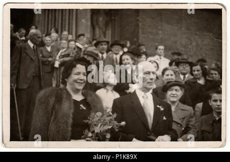 PRAGUE, THE CZECHOSLOVAK SOCIALIST REPUBLIC - JUNE 2, 1951: Vintage photo shows elderly newlyweds after wedding ceremony. 1950s Stock Photo