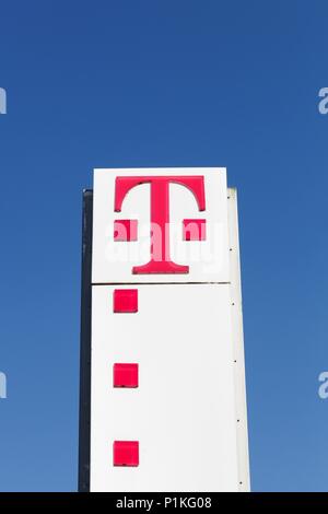Flensburg, Germany - June 4, 2016: Deutsche Telekom sign on a panel. Deutsche Telekom is a German telecommunications company headquartered in Bonn Stock Photo