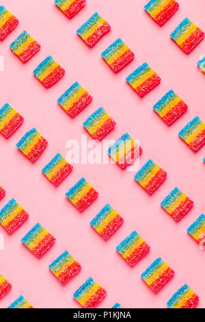 Colorful candies pattern on a pink background. Top view. Stock Photo