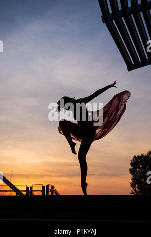 Elegant ballet dancer woman dancing ballet in Singapore city Stock Photo