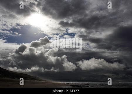 Stormy Dark Overcast Ocean Coastline With Sunshine