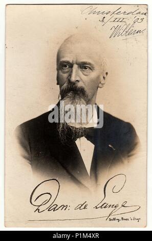 AMSTERDAM, THE NETHERLANDS - MARCH 3, 1903: Vintage photo shows man with full beard.  Antique black & white photography. Image contains handwriting. Stock Photo
