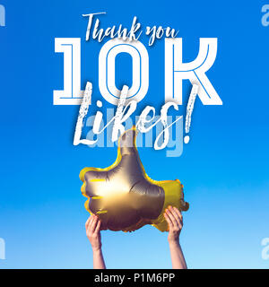 Thank you 10 thousand likes gold thumbs up like balloons social media template banner Stock Photo