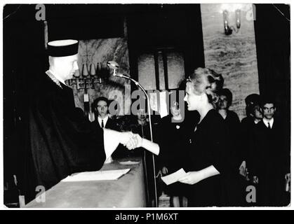 THE CZECHOSLOVAK SOCIALIST REPUBLIC - MARCH 31, 1965: Retro photo shows graduation celebration. Black & white vintage photography Stock Photo