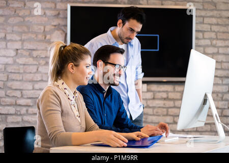 Young architects working on project in office Stock Photo
