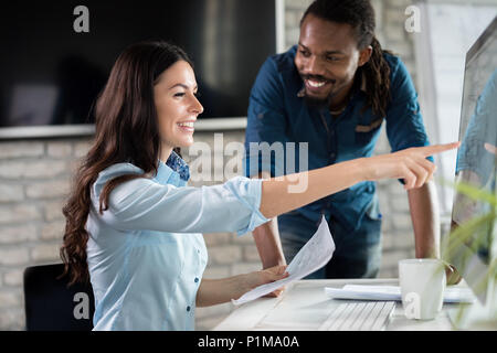 Young architects working on project in office Stock Photo