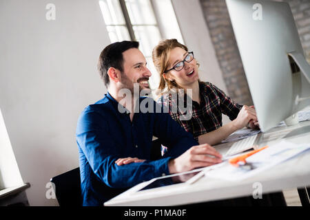 Young architects working on project in office Stock Photo