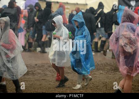 Revelers enjoy the rain at Glastonbury Festival 2015 - Friday Stock Photo