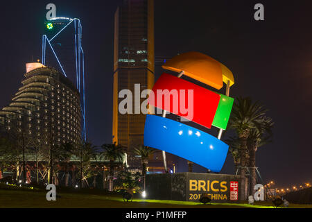 Xiamen, China - Apr 05, 2018: BRICS Sculpture with Modern Skyscraper Background Stock Photo