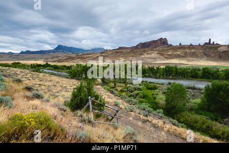 Rugged, arid landscape with Shoshone river flanked by Rocky mountains in Buffalo Bill State Park in Cody, Wyoming, USA. Stock Photo