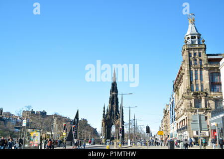 A view of Princes Street basking in sunshine with the Scott Monument in the distance as well as Jenners on the right hand side. Edinburgh, Scotland Stock Photo