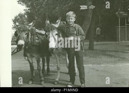 USSR - CIRCA 1970s: Retro photo shows children ride on donkeys in the ...