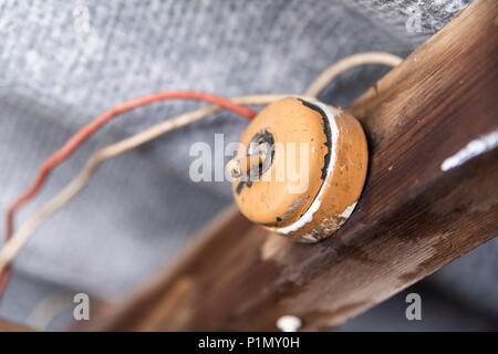 Old light switch inside a shed with dangerous wiring and asbestos roof Stock Photo