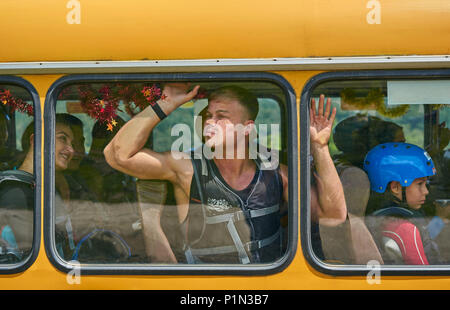 man was pressed down to the window in the bus Stock Photo