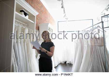 Business owner  checking inventory in clothing shop  Stock 