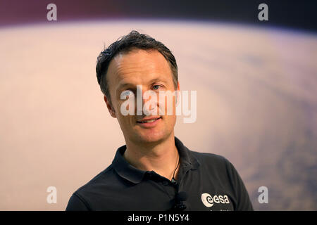 12 June 2018, Germany, Cologne: Matthias Maurer, German ESA astronaut, presents a video stream with Alexander Gerst, who is answering journalists' questions from the International Space Station. Photo: Oliver Berg/dpa Stock Photo