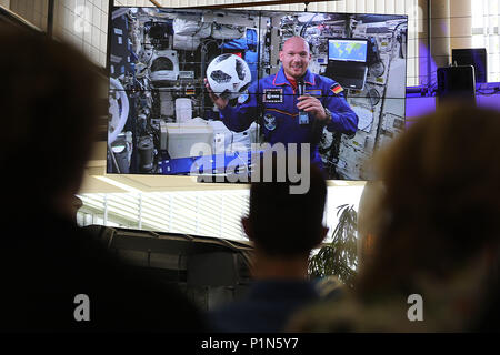 12 June 2018, Germany, Cologne: German astronaut Alexander Gerst can be seen on a monitor at the ESA, as he answers journalists' questions from the International Space Station. Photo: Oliver Berg/dpa Stock Photo