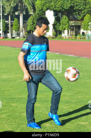 Guwahati, Assam, India. 11th June 2018. Former Indian football team captain Bhaichung Bhutia playing football with young footballers of SAI complex in Guwahati.  Bhaichung Bhutia arrives in the city to promote the Vector X FIFA Accredited footballs. Photo: David Talukdar/Alamy Livenews Credit: David Talukdar/Alamy Live News Stock Photo