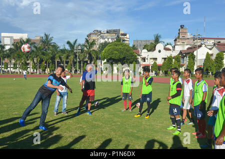 Guwahati, Assam, India. 11th June 2018. Former Indian football team captain Bhaichung Bhutia playing football with young footballers of SAI complex in Guwahati.  Bhaichung Bhutia arrives in the city to promote the Vector X FIFA Accredited footballs. Photo: David Talukdar/Alamy Livenews Credit: David Talukdar/Alamy Live News Stock Photo