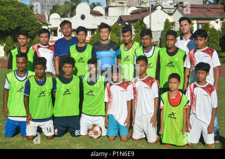 Guwahati, Assam, India. 11th June 2018. Former Indian football team captain Bhaichung Bhutia playing football with young footballers of SAI complex in Guwahati.  Bhaichung Bhutia arrives in the city to promote the Vector X FIFA Accredited footballs. Photo: David Talukdar/Alamy Livenews Credit: David Talukdar/Alamy Live News Stock Photo