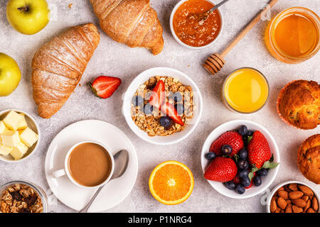 Continental breakfast with fresh croissants, orange juice and coffee, top view. Stock Photo