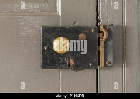 Old Bass and Iron Door Knob and Lock Hardware Stock Photo