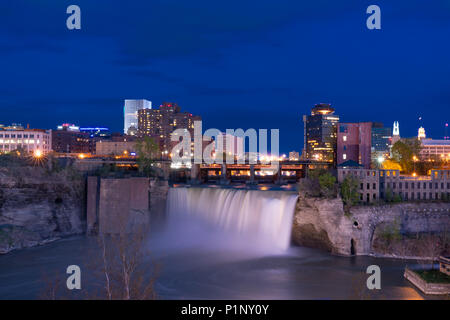 ROCHESTER, NY - MAY 14, 2018: Skyline of Rochester, New York at the High Falls along the Genesee River at night Stock Photo