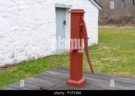 Old Red Manual Water Well Pump Stock Photo