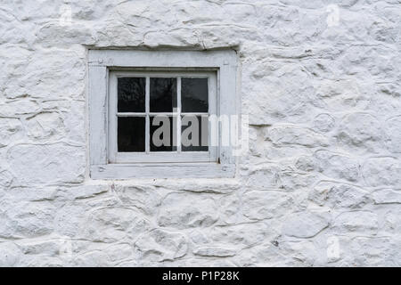 Old White Window on a stone whitewashed cottage Stock Photo