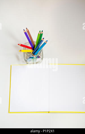 all for children creativity, pencils, scissors, colored paper, there is a place for text Stock Photo
