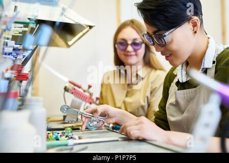 Female Artists Working in Glassworking Studio Stock Photo