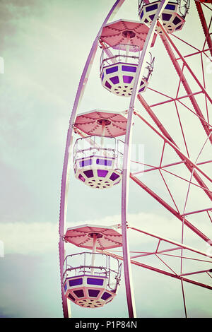 Retro toned picture of Ferris wheel cars. Stock Photo