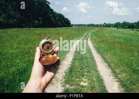 Man with compass in hand Stock Photo