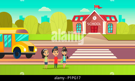 Pupils are near the school bus. School across the road. Transition in front of the school. Students are going to learn. Back to school concept. Stock Photo
