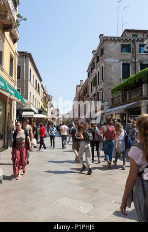 Pedetsrians walking along Strada Nuova, Cannaregio, Venice, veneto, Italy, a popular shopping street with both local Venetians and tourists Stock Photo