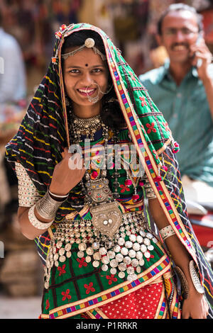 Portrait of a Hindu Indian woman in colourful traditional clothing and accessories, Jaisalmer Fort; Jaisalmer, Rajasthan, India Stock Photo