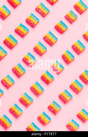 Colorful candies pattern on a pink background. Top view. Stock Photo