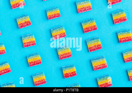 Colorful candies pattern on a blue background. Top view. Stock Photo