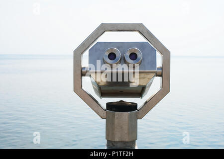 seaside overlook with coin-operated binoculars, travel vacation and observation concept Stock Photo