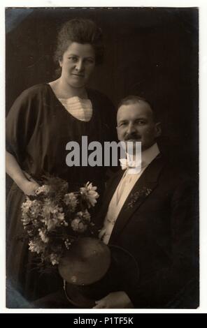 GERMANY- CIRCA 1923: Vintage photo shows an elderly couple. Retro black & white studio photography. Stock Photo