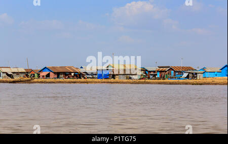 Siem Reap, Cambodia - January 2014: Houses in Village at Tonle Sap lake in Siem Reap, Cambodia Stock Photo