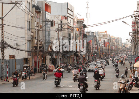 Saigon, Vietnam - January 2014: Scooter traffic on crowded streets with many motorbikes in Saigon a.k.a. Ho Chi Minh City, Vietnam Stock Photo