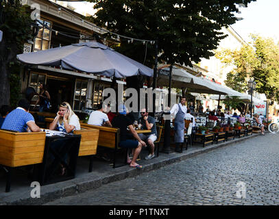 Derybasivska Street is a pedestrian street in Odessa. Many popular cafes and restaurants are line along this colorful street. Stock Photo