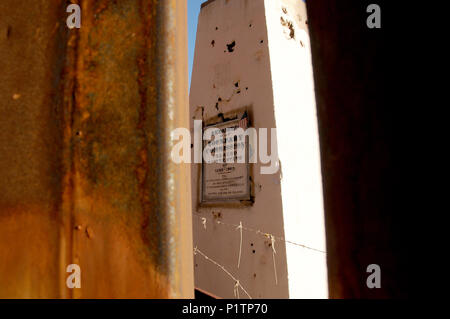 A cement column marking the U.S./Mexico border remains along the metal wall as seen near the property of Glenn Spencer of the American Border Patrol,  Stock Photo