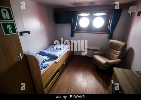 A bedroom onboard a state-of-the-art Service Operation Vessel (SOV) that remains offshore with technicians working shifts of 14 days on and 14 days off at the Race Bank development, the fifth biggest wind farm in the world that has opened off the Norfolk and Lincolnshire coast with 91 huge turbines. Stock Photo