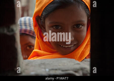 Portrait of a maktab student. Maktab an Arabic word meaning schools for teaching children in elementary Islamic subjects. Dhaka, Bangladesh. Stock Photo