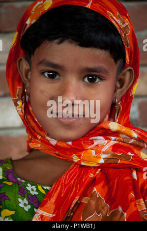 Portrait of a maktab student. Maktab an Arabic word meaning schools for teaching children in elementary Islamic subjects. Dhaka, Bangladesh. Stock Photo