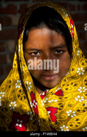 Portrait of a maktab student. Maktab an Arabic word meaning schools for teaching children in elementary Islamic subjects. Dhaka, Bangladesh. Stock Photo